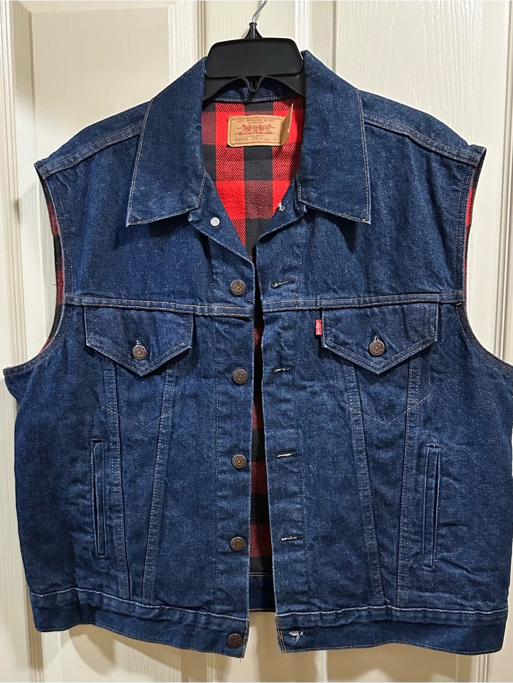 Vintage 1980s Levi's 60518 0816 denim vest with a red plaid flannel lining. XL
